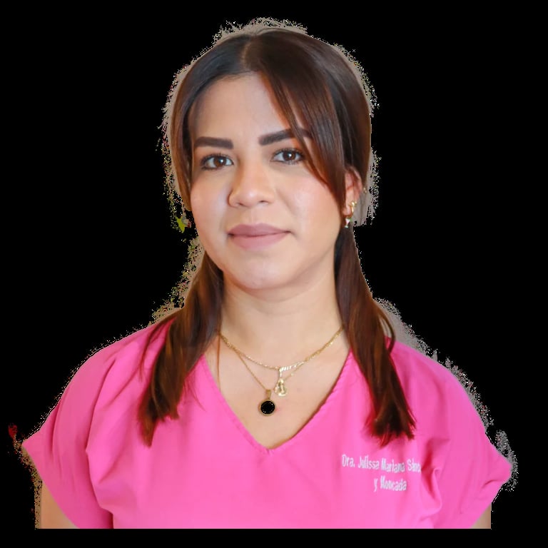 Portrait of a woman with long brown hair wearing a pink v-neck shirt with text, smiling at the camera against a black background