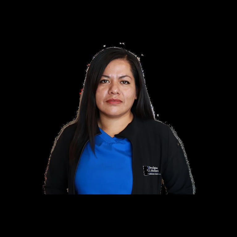 Professional headshot of a woman with long black hair wearing a blue top and black cardigan against a black background