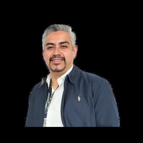 Professional headshot of a man with gray hair and goatee wearing a dark blue jacket over a white shirt