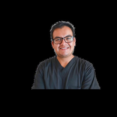 Professional headshot of a man wearing glasses and a dark charcoal v-neck shirt against a black background