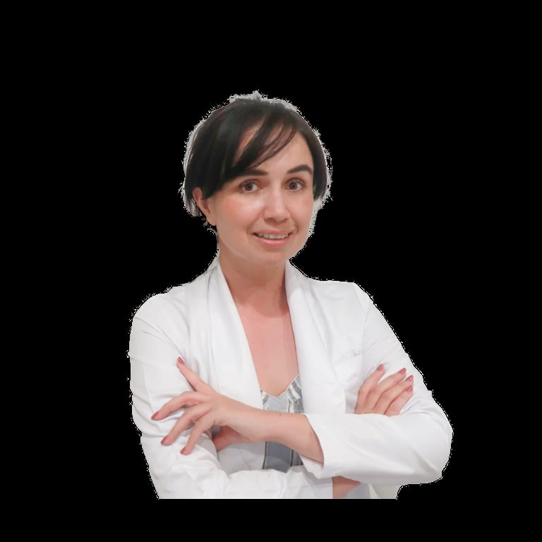 Professional woman in white blazer with arms crossed, smiling at camera against black background