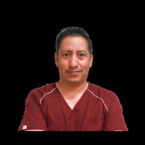 Professional headshot of a person wearing a burgundy medical or healthcare uniform against a black background