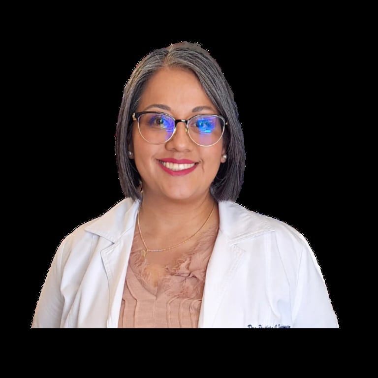 Woman wearing blue-tinted glasses and white blazer over beige top, smiling at camera against black background