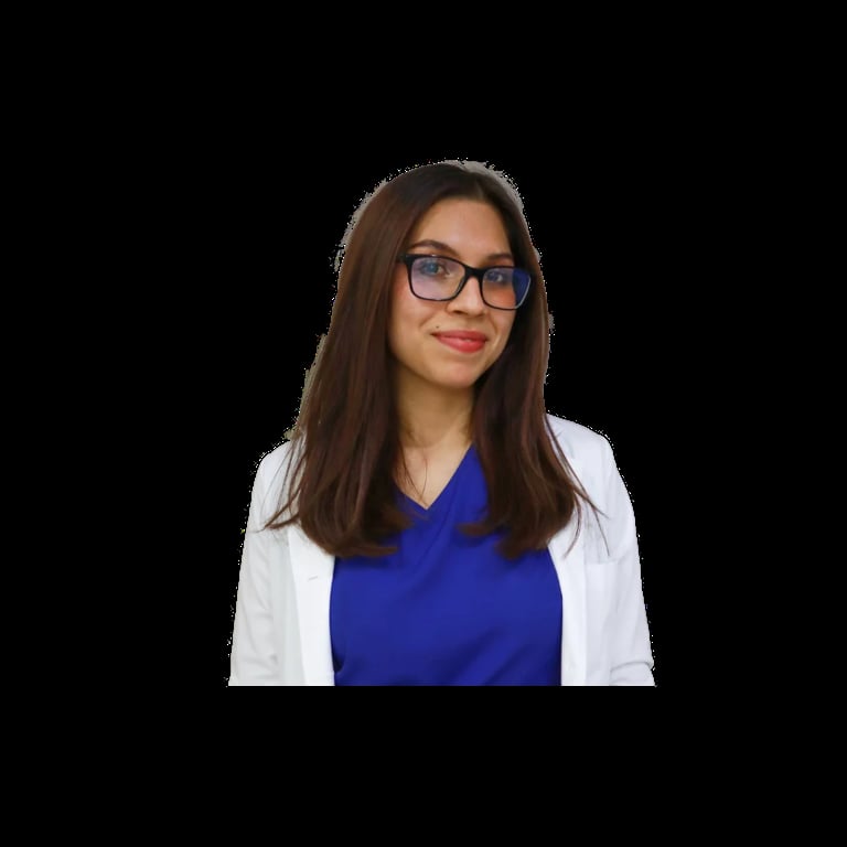 Professional portrait of a woman with long brown hair wearing glasses, a blue v-neck top, and white cardigan against a black background