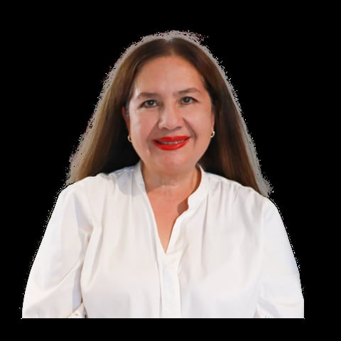 Portrait of a woman with long brown hair wearing a white button-up shirt and red lipstick against a black background