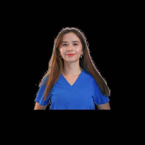 Portrait of a woman with long reddish-brown hair wearing a blue V-neck shirt against a black background
