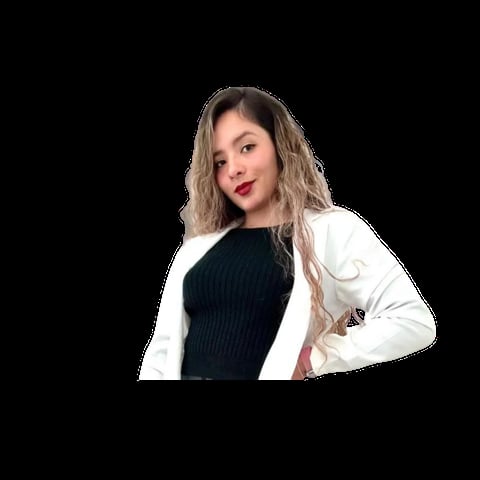 Woman with long layered blonde hair wearing a black ribbed sweater and white cardigan against a black background