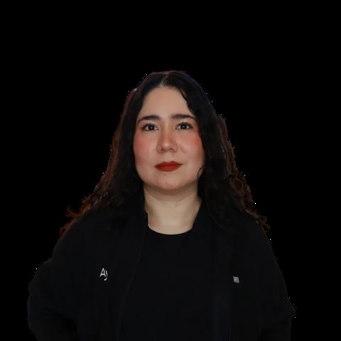 Woman with long dark hair and red lipstick wearing a black blazer against a black background
