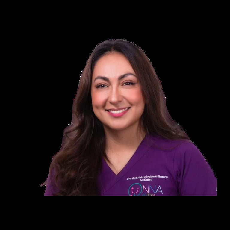 Professional headshot of a smiling woman with long dark hair wearing a purple medical scrubs top against a black background