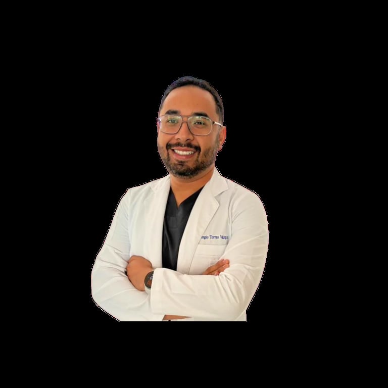 Male healthcare professional wearing white lab coat and glasses, smiling with arms crossed against black background